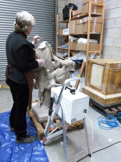 Jane using paraloid mix on the sculpture